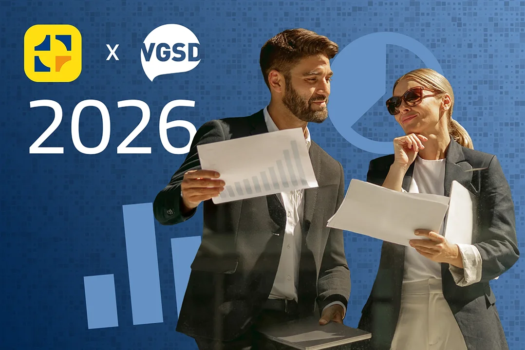 Zwei Personen betrachten gemeinsam betriebliche Unterlegen. Links in der Ecke die Logos von WISO MeinBüro und dem VGSD.